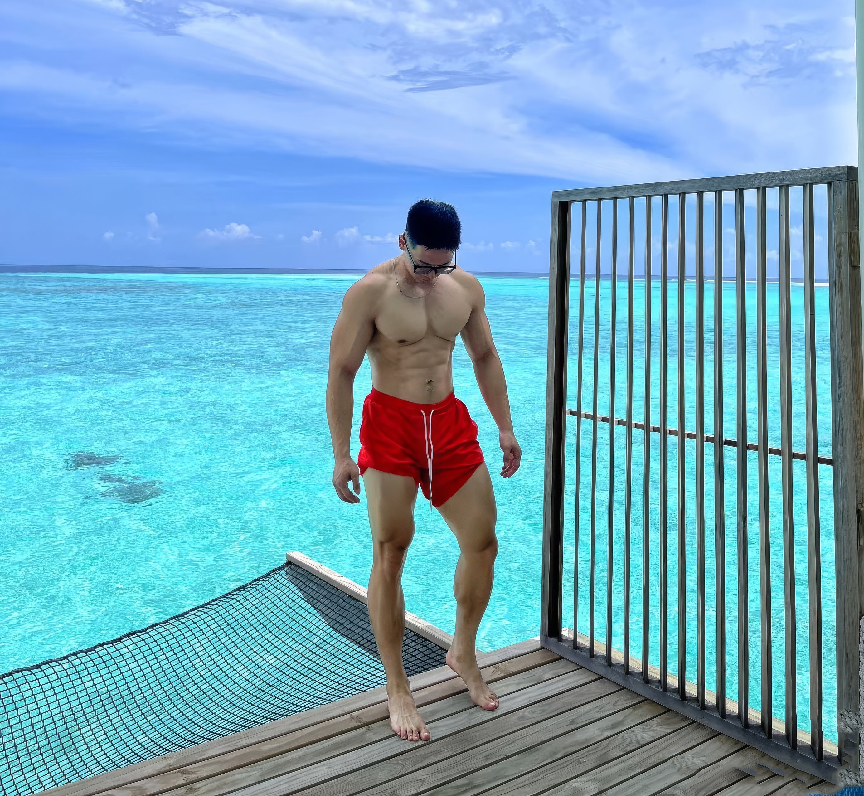 a hot gay man in sexy gay swim trunks from Pridevyageshop