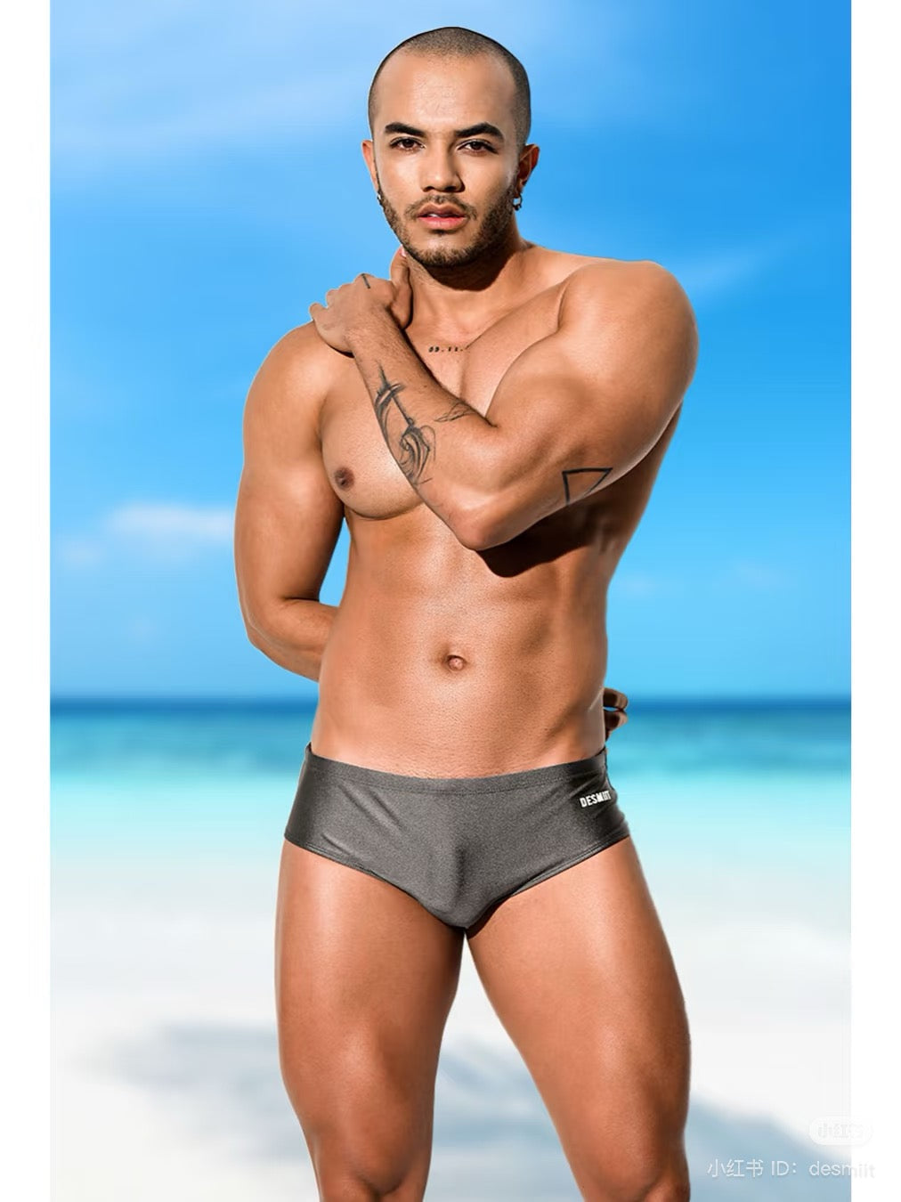 a sexy gay man in sexy Desmiit swimwear from ridevoyageshop
