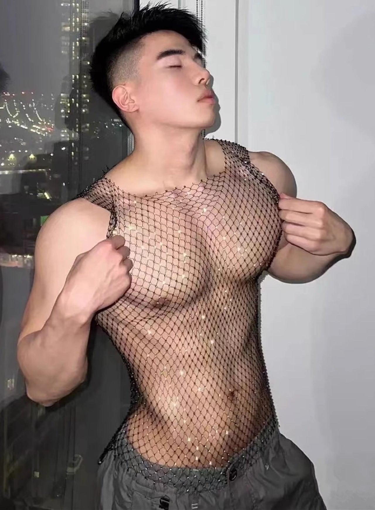 a sexy gay man in sexy gay mesh sheer tops from Pridevoyageshop