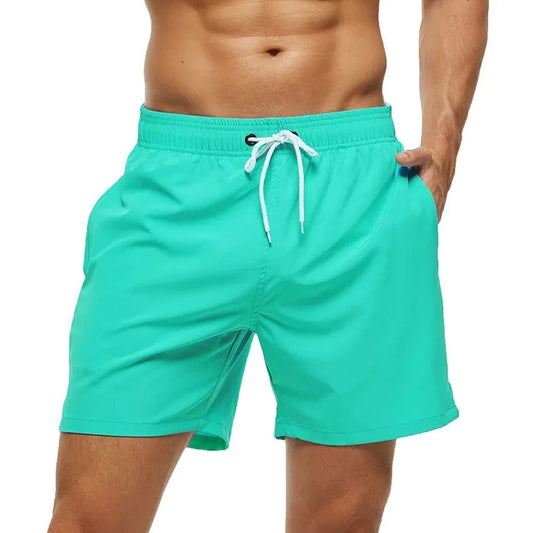 a hot gay man in grass green Solid Color Pocketed Board Shorts - pridevoyageshop.com - gay men’s underwear and swimwear