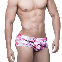 sexy gay man in Gay Swimwear | Pink Watercolor Swim Briefs- pridevoyageshop.com - gay men’s underwear and swimwear