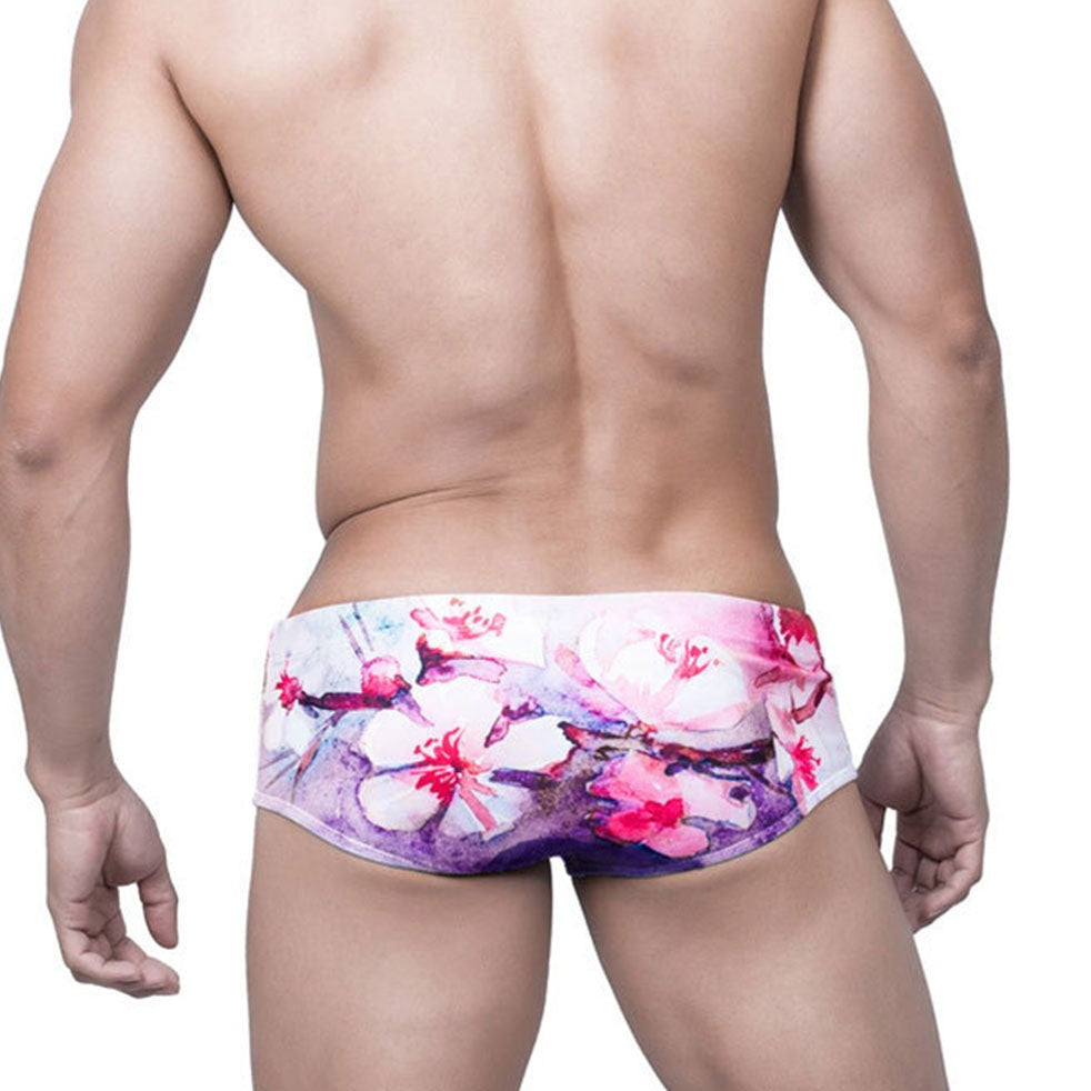 sexy gay man in Gay Swimwear | Pink Watercolor Swim Briefs- pridevoyageshop.com - gay men’s underwear and swimwear