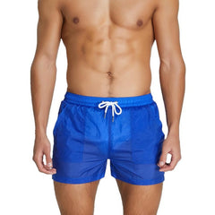 sexy gay man in blue Gay Beachwear | Men's Transparent Board Shorts with Pockets - pridevoyageshop.com - gay men’s underwear and swimwear