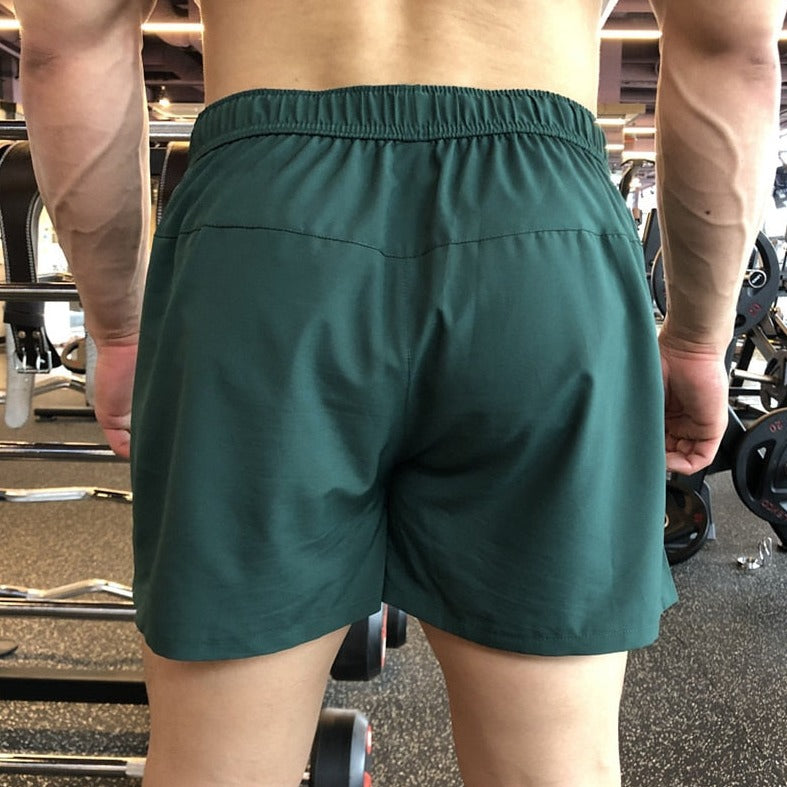 gay hunk in green Mens Ultra Power Training Shorts | Gay Shorts - Men's Activewear, gym short, sport shorts, running shorts- pridevoyageshop.com