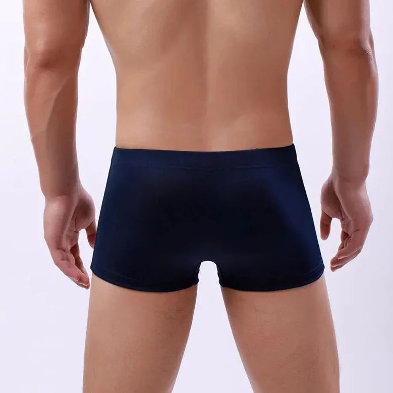 a hot gay man in dark blue Men's 23 Bowtie Swim Trunks - pridevoyageshop.com - gay men’s underwear and swimwear