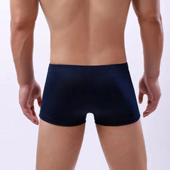 a hot gay man in dark blue Men's 23 Bowtie Swim Trunks - pridevoyageshop.com - gay men’s underwear and swimwear
