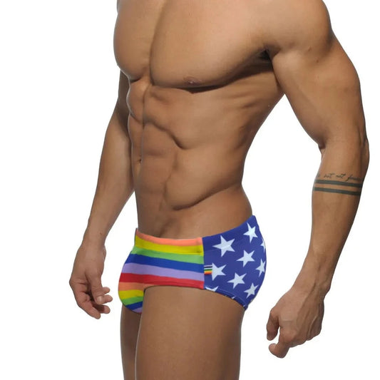 a hot gay man in Men's Patriotic Rainbow Swim Briefs - pridevoyageshop.com - gay men’s underwear and swimwear