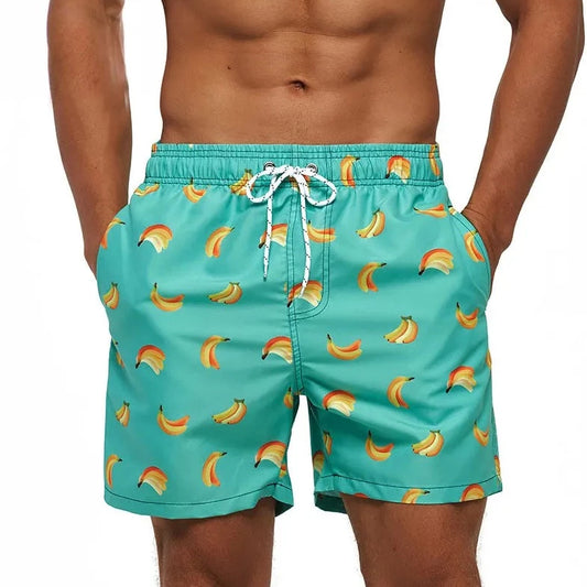 a hot gay man in Falling Bananas Board Shorts - pridevoyageshop.com - gay men’s underwear and swimwear