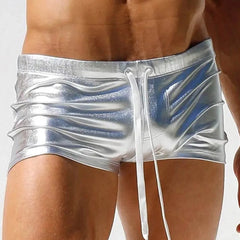 a sexy gay man in silver Men's Liquid Metallic Swim Trunks - pridevoyageshop.com - gay men’s underwear and swimwear