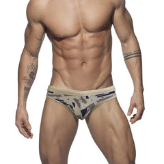 a sexy gay man in tan Men's Urban Camo Swim Briefs - pridevoyageshop.com - gay men’s underwear and swimwear