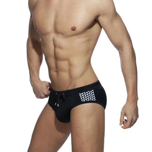 a sexy gay man in black Monochrome Matrix Swim Briefs - pridevoyageshop.com - gay men’s underwear and swimwear
