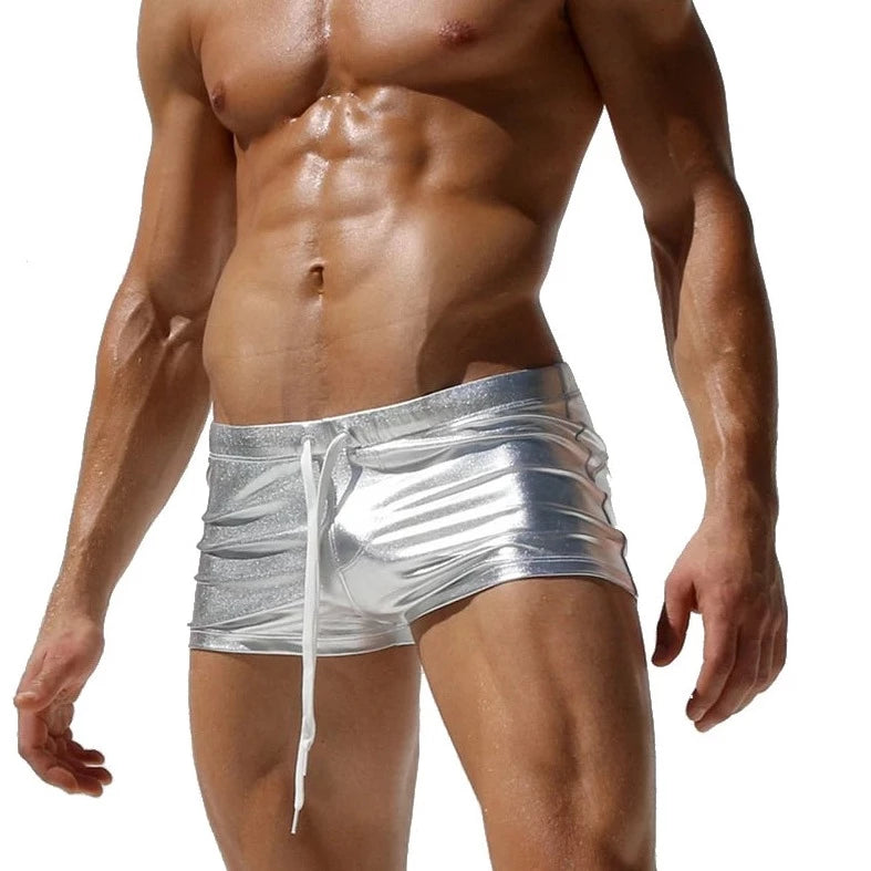 a sexy gay man in silver Men's Liquid Metallic Swim Trunks - pridevoyageshop.com - gay men’s underwear and swimwear
