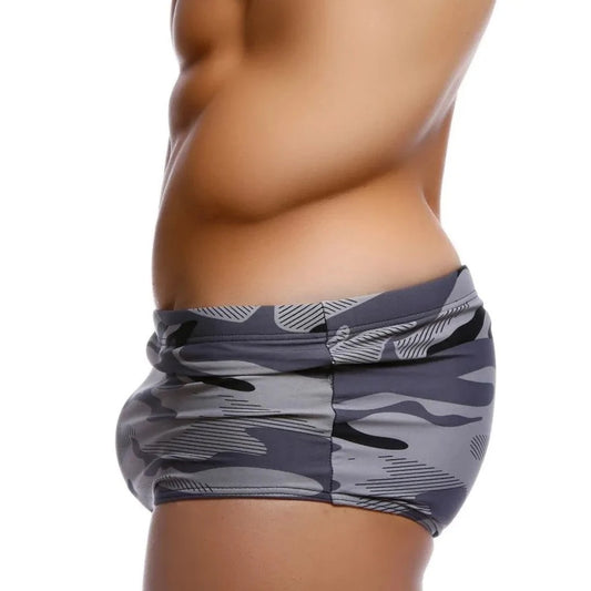 a hot gay man in gray Modern Camo Square Cut Swim Trunks - pridevoyageshop.com - gay men’s underwear and swimwear