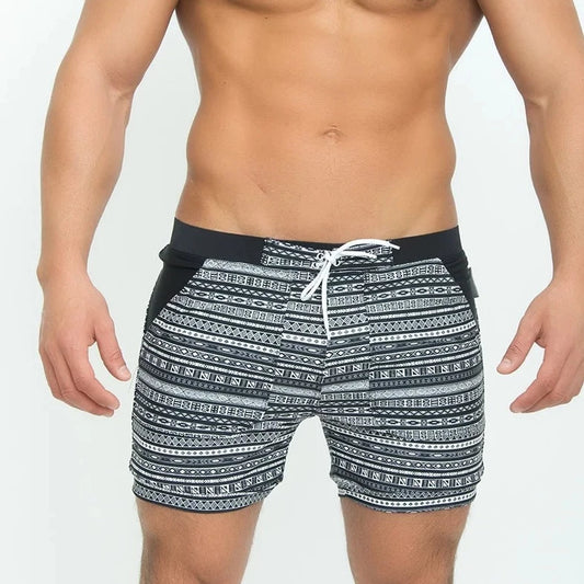 a hot man in Aztec Tribal Tight Board Shorts - pridevoyageshop.com - gay men’s underwear and swimwear