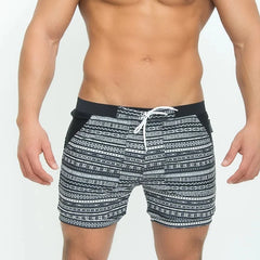 a hot man in Aztec Tribal Tight Board Shorts - pridevoyageshop.com - gay men’s underwear and swimwear