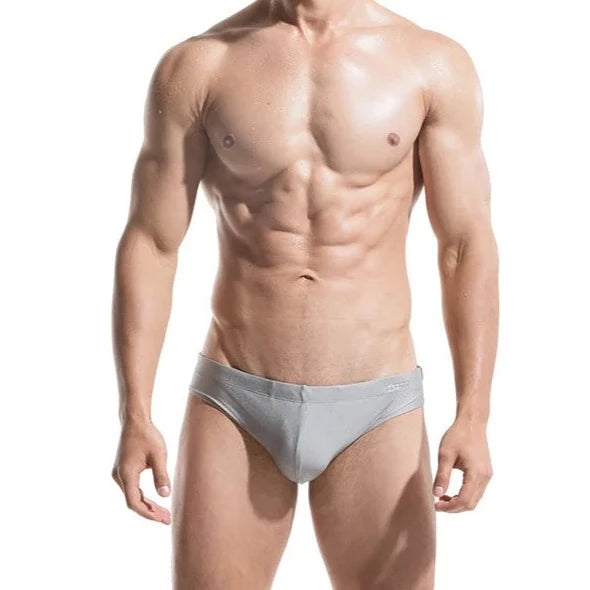 a sexy gay man in gray DESMIIT Solid Color Swim Briefs - pridevoyageshop.com - gay men’s underwear and swimwear