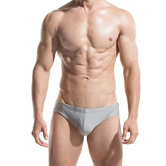 a sexy gay man in gray DESMIIT Solid Color Swim Briefs - pridevoyageshop.com - gay men’s underwear and swimwear