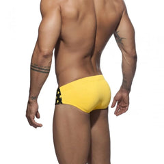a hot gay man in black Men's Bowtie Stars Swim Briefs - pridevoyageshop.com - gay men’s underwear and swimwear