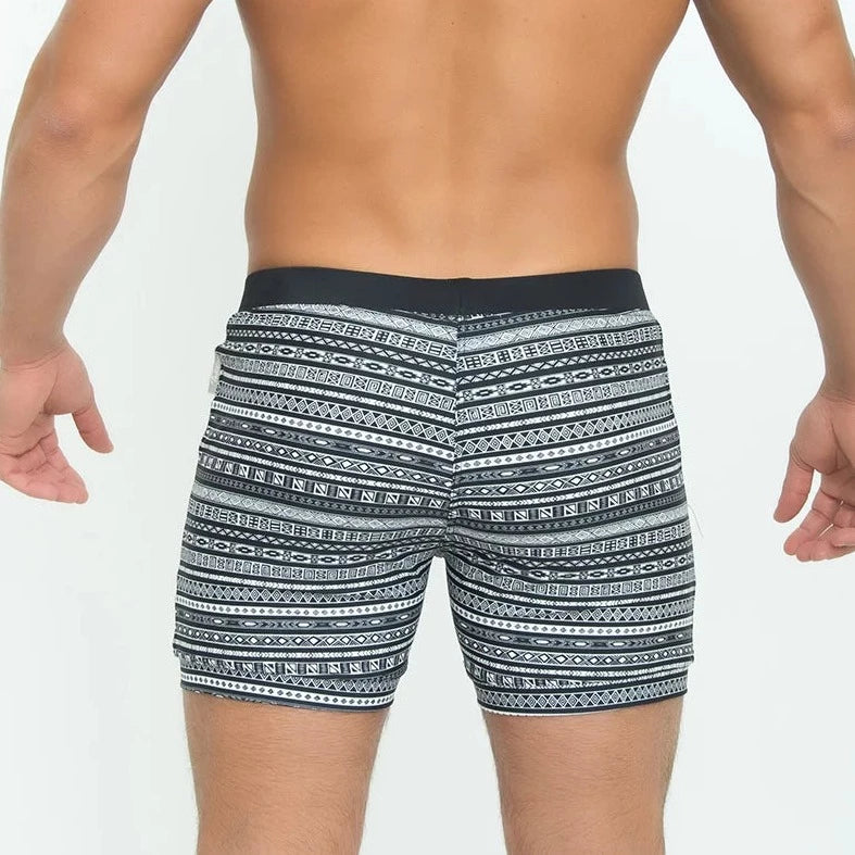 a hot man in Aztec Tribal Tight Board Shorts - pridevoyageshop.com - gay men’s underwear and swimwear