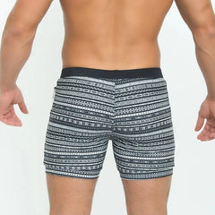 a hot man in Aztec Tribal Tight Board Shorts - pridevoyageshop.com - gay men’s underwear and swimwear