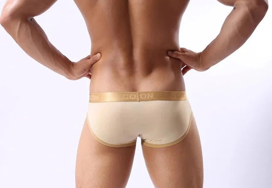 a hot gay man in beige COCKCON Barely There Briefs - pridevoyageshop.com - gay men’s underwear and activewear