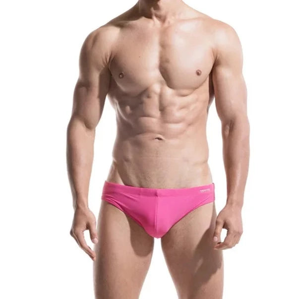 a sexy gay man in pink DESMIIT Solid Color Swim Briefs - pridevoyageshop.com - gay men’s underwear and swimwear