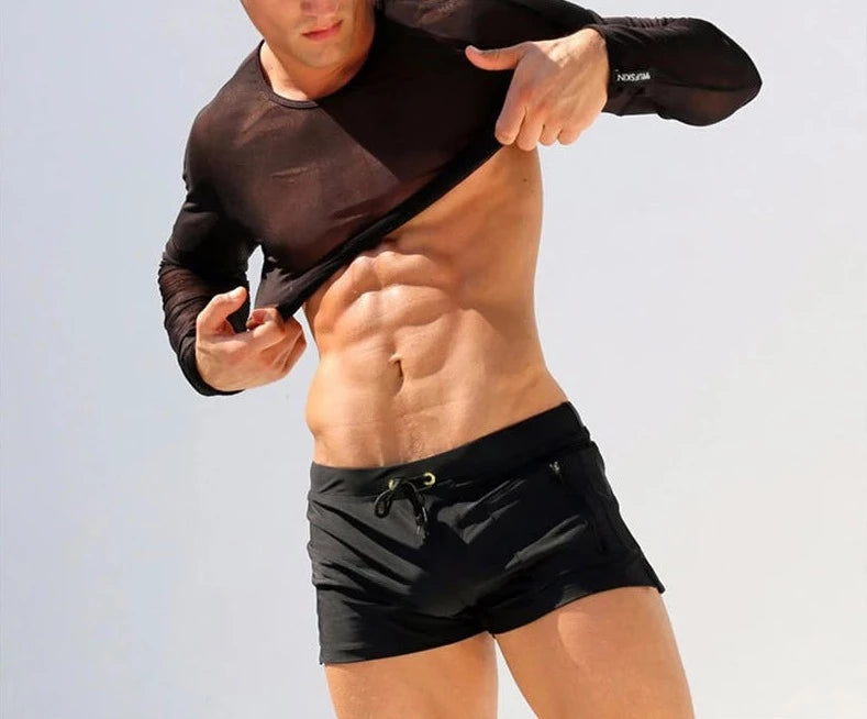 a hot gay man in black Solid Color Pocketed Swim Trunks - pridevoyageshop.com - gay men’s underwear and swimwear