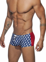 a hot gay man in blue Stars Tight Square Cut Swim Trunks - pridevoyageshop.com - gay men’s underwear and swimwear