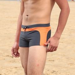 hot gay man in gray and orange Gay Swimwear & Beachwear | Quick Dry Aqua Shape Swim Trunks - pridevoyageshop.com - gay men’s underwear and swimwear