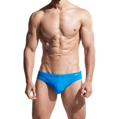 a sexy gay man in blue DESMIIT Solid Color Swim Briefs - pridevoyageshop.com - gay men’s underwear and swimwear