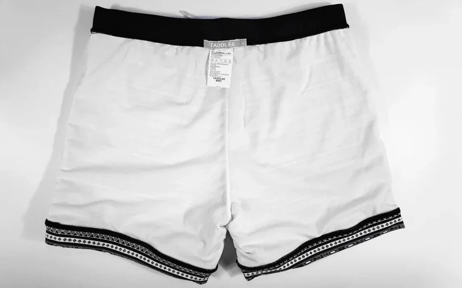 details of a hot man in Aztec Tribal Tight Board Shorts - pridevoyageshop.com - gay men’s underwear and swimwear