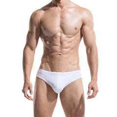 a sexy gay man in white DESMIIT Solid Color Swim Briefs - pridevoyageshop.com - gay men’s underwear and swimwear
