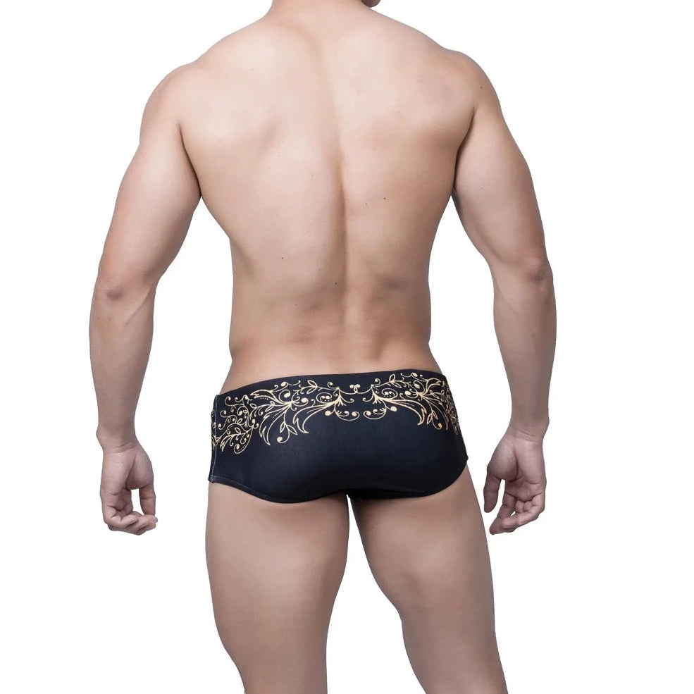 a hot gay man in Gold Fleur de Lis Square Cut Swim Trunks - pridevoyageshop.com - gay men’s underwear and swimwear