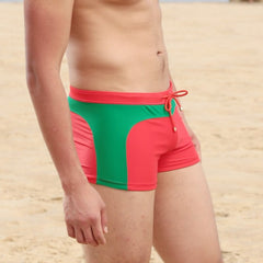 hot gay man in red and green Gay Swimwear & Beachwear | Quick Dry Aqua Shape Swim Trunks - pridevoyageshop.com - gay men’s underwear and swimwear
