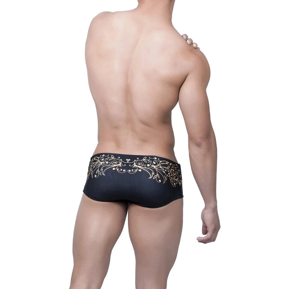 a hot gay man in Gold Fleur de Lis Square Cut Swim Trunks - pridevoyageshop.com - gay men’s underwear and swimwear