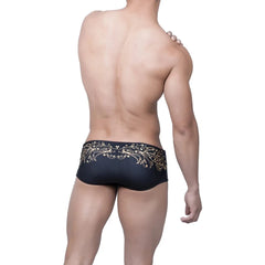 a hot gay man in Gold Fleur de Lis Square Cut Swim Trunks - pridevoyageshop.com - gay men’s underwear and swimwear