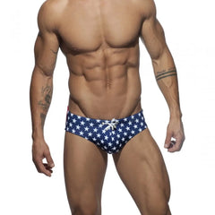a hot gay man in blue Men's Bowtie Stars Swim Briefs - pridevoyageshop.com - gay men’s underwear and swimwear