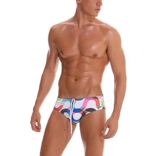 a hot gay man in Men's S-Wave Swim Briefs - pridevoyageshop.com - gay men’s underwear and swimwear