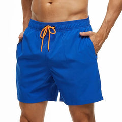 a hot gay man in blue Solid Color Pocketed Board Shorts - pridevoyageshop.com - gay men’s underwear and swimwear