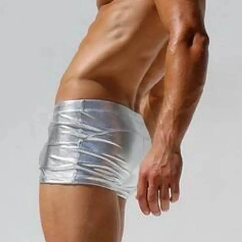 a sexy gay man in silver Men's Liquid Metallic Swim Trunks - pridevoyageshop.com - gay men’s underwear and swimwear