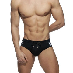 a sexy gay man in black Monochrome Matrix Swim Briefs - pridevoyageshop.com - gay men’s underwear and swimwear