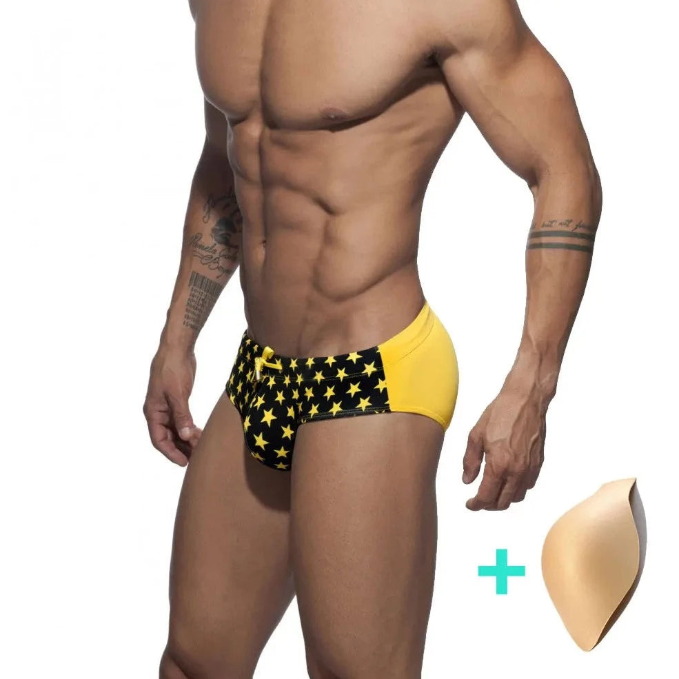 a hot gay man in black Men's Bowtie Stars Swim Briefs - pridevoyageshop.com - gay men’s underwear and swimwear