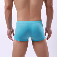 a hot gay man in sky blue Men's 23 Bowtie Swim Trunks - pridevoyageshop.com - gay men’s underwear and swimwear