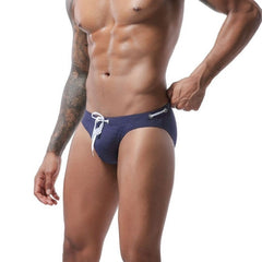 hot gay man in dark blue Gay Swimwear | Men's Bold Bowtie Swim Briefs- pridevoyageshop.com - gay men’s underwear and swimwear