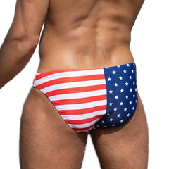 a hot gay man in US National Flags Skinny Swim Briefs - pridevoyageshop.com - gay men’s underwear and swimwear