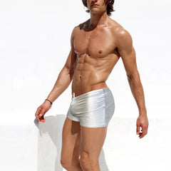 a sexy gay man in silver Men's Liquid Metallic Swim Trunks - pridevoyageshop.com - gay men’s underwear and swimwear
