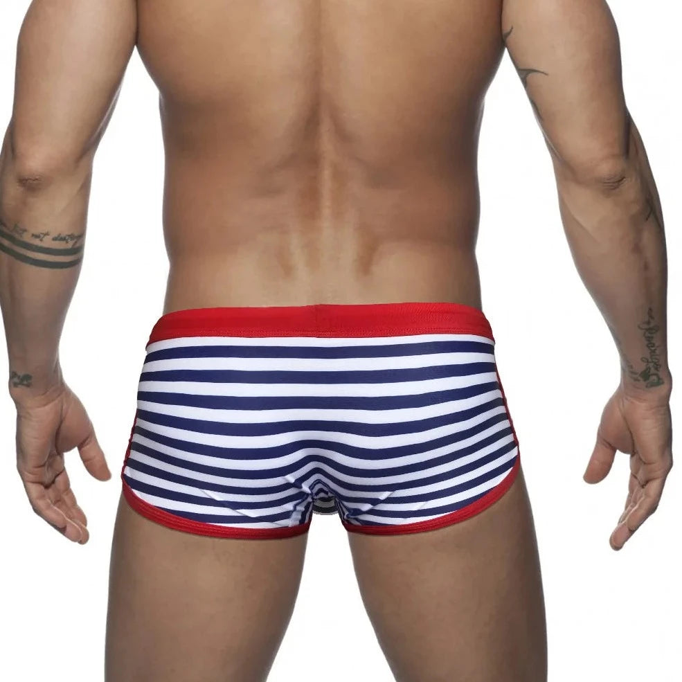 a hot gay man in blue Mariner Stripe Swim Trunks - pridevoyageshop.com - gay men’s underwear and swimwear