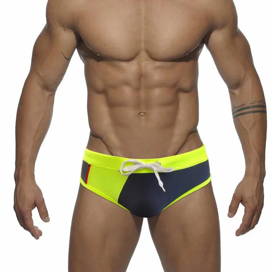 a sexy gay man in yellow Men's Patchwork Bowtie Swim Briefs - pridevoyageshop.com - gay men’s underwear and swimwear