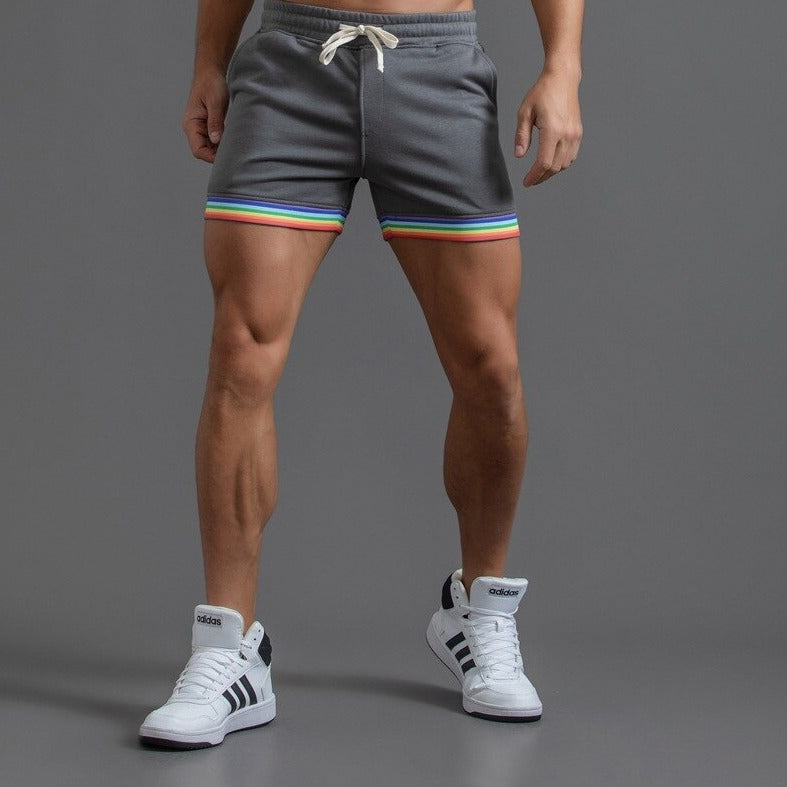 sexy gay man in gray Men's Rainbow Gym Shorts with Pockets | Gay Shorts - Men's Activewear, gym short, sport shorts, running shorts- pridevoyageshop.com