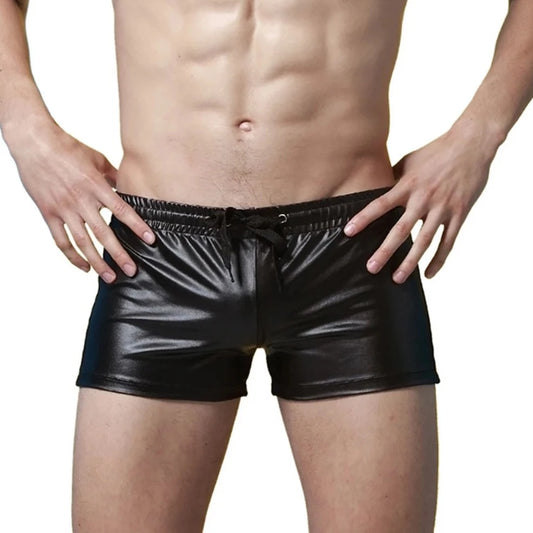 a sexy gay man in black Solid Color Faux Leather Swim Trunks - pridevoyageshop.com - gay men’s underwear and swimwear